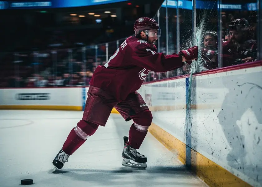 Boston Bruins players warming up on ice before a critical road game against the Pittsburgh Penguins