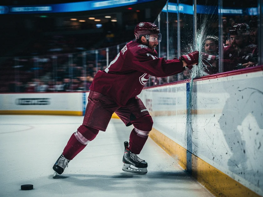 Boston Bruins players warming up on ice before a critical road game against the Pittsburgh Penguins