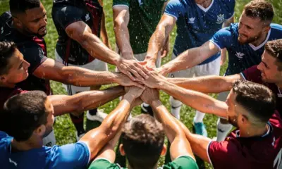 Mike McCarthy waves to Pittsburgh Penguins fans during NHL Coaching Changes coverage at the arena