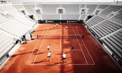 Players competing in Davis Cup Tennis Nations League tie on clay court in 2026