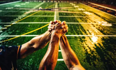 Tennis player and coach discussing strategy courtside, representing 2026 Tennis Coaching Changes on clay